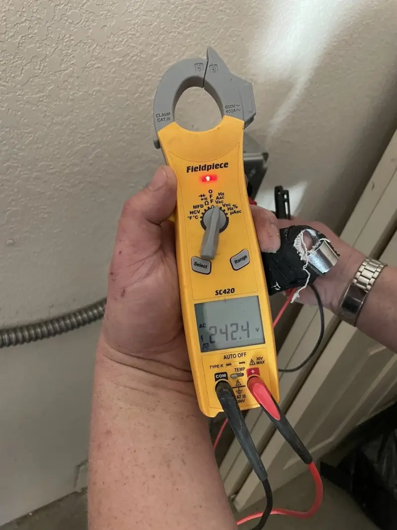 Voltage testing with clamp meter during Ceiling Fan Installation in Windsor